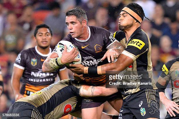 Corey Parker of the Broncos looks to pass during the round 20 NRL match between the Brisbane Broncos and the Penrith Panthers at Suncorp Stadium on...