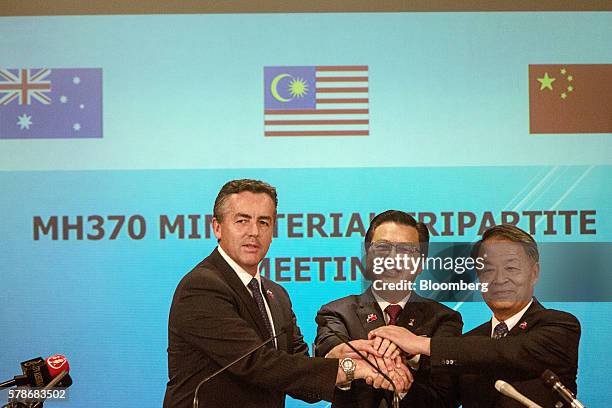 Darren Chester, Australia's minister of infrastructure and transport, from left, Liow Tiong Lai, Malaysia's minister of transport, and Yang...