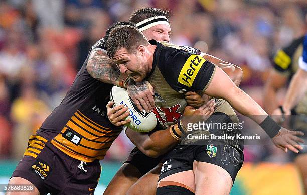 Trent Merrin of the Panthers takes on the defence during the round 20 NRL match between the Brisbane Broncos and the Penrith Panthers at Suncorp...