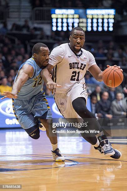 Butler Bulldogs forward Roosevelt Jones drives by Marquette Golden Eagles guard Derrick Wilson during the NCAA basketball game between the Butler...
