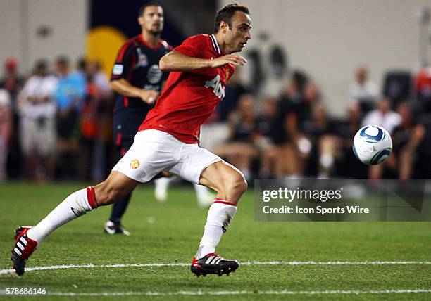 Dimitar Berbatov of Manchester United races forward on the way to score the third goal during the MLS All-Star game against the MLS All-Stars at Red...