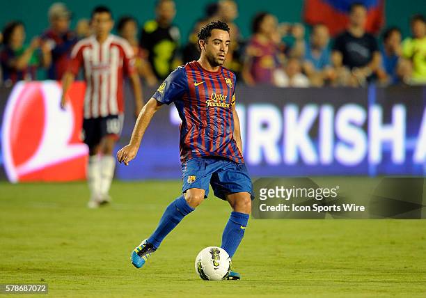 Barcelona midfielder Xavi Hernandez plays against Chivas De Guadalajara at Sun Life Stadium, Miami, Florida, in Chivas' 4-1 victory in the Herbalife...