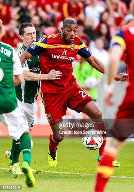 Real Salt Lake defender Chris Schuler battles with Portland Timbers midfielder Will Johnson during the MLS game between Real Salt Lake and the...