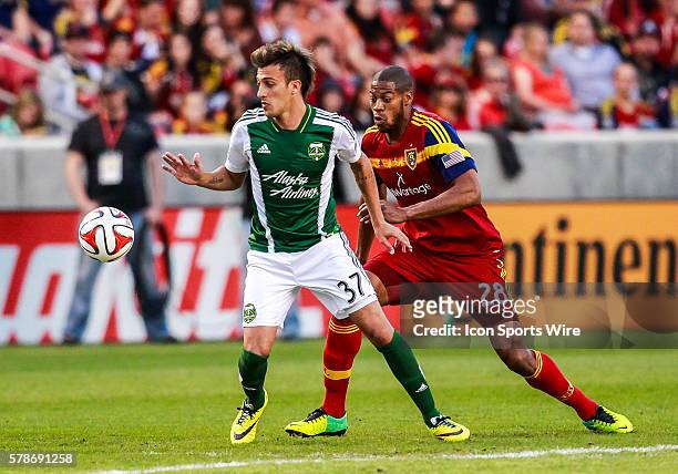 Portland Timbers midfielder Maximiliano Urruti controls the ball in front of Real Salt Lake defender Chris Schuler during the MLS game between Real...