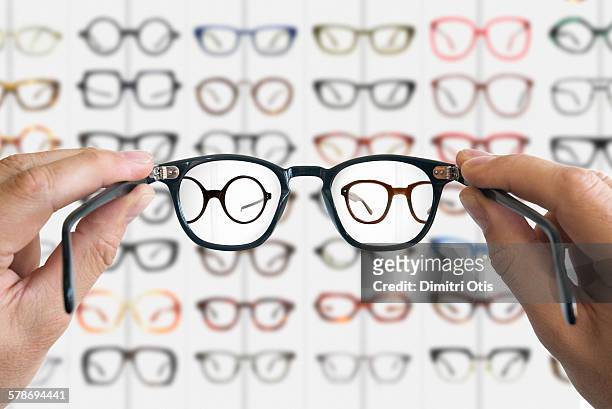 spectacles focussed on distant specs - spectacles stock pictures, royalty-free photos & images