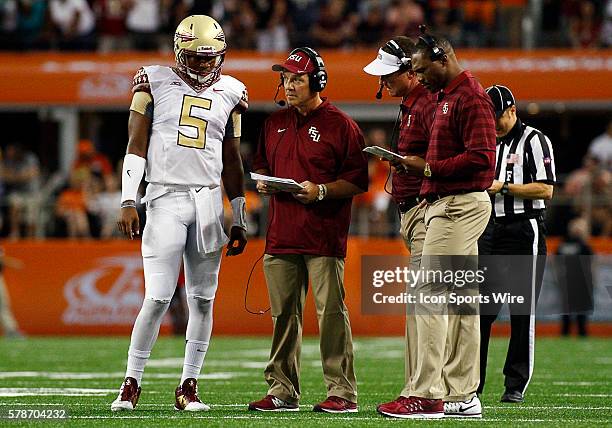 Florida State Seminoles quarterback Jameis Winston and Florida State Seminoles head coach Jimbo Fisher during a NCAA football game between the...