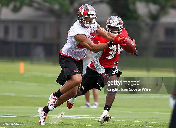 Vincent Jackson fights makes a catch against Danny Gorrer during the Buccaneers Voluntary Mini Camp at One Buccaneer Place in Tampa, Florida.