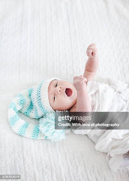 newborn baby boy in elf hat - elf hat stock pictures, royalty-free photos & images