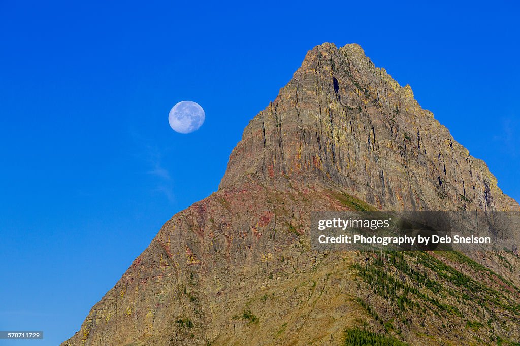 Peak of Mt Grinnell with moon