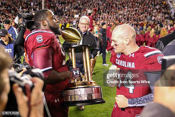 South Carolina Gamecocks defensive tackle Kelcy Quarles and South Carolina Gamecocks quarterback Connor Shaw with the Hardees Trophy at...