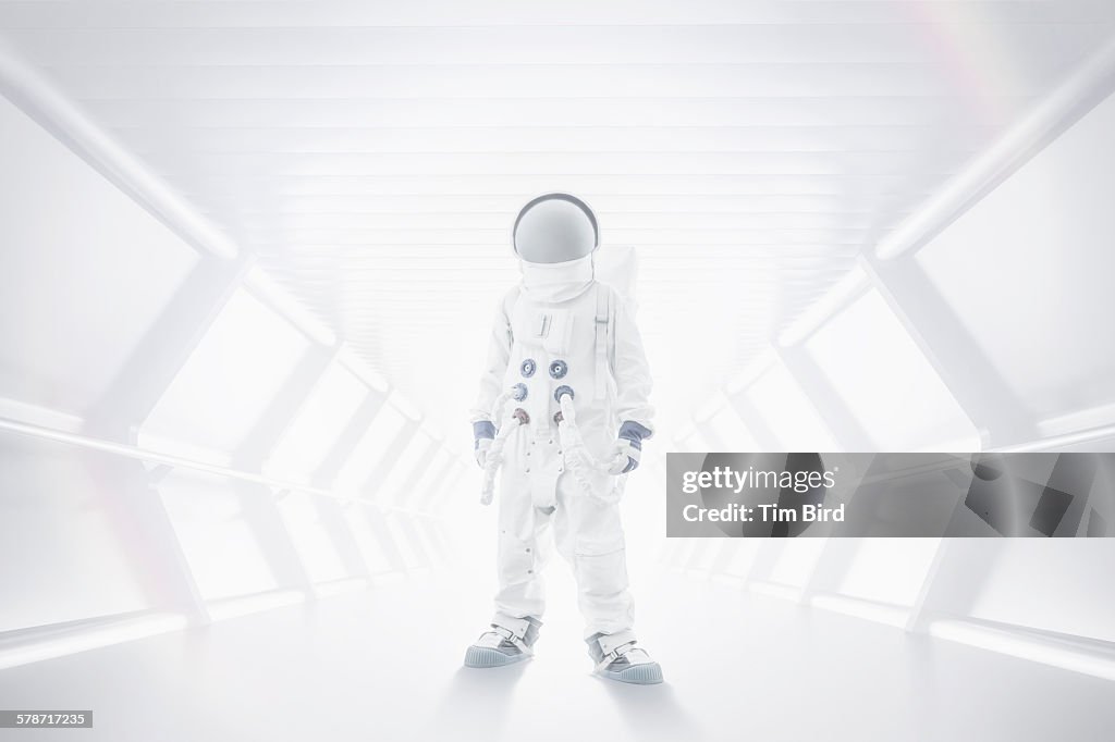 Spaceman standing in tunnel