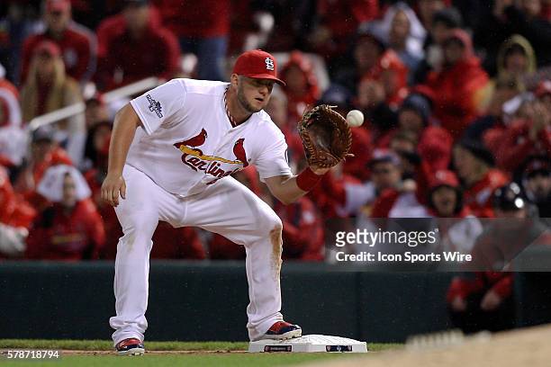 St. Louis Cardinals first baseman Matt Adams catches for an out at first base against the Los Angeles Dodgers during game six of the NLCS Playoffs at...