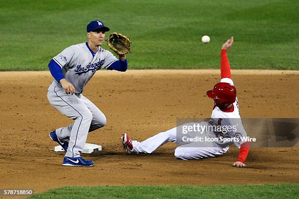 St. Louis Cardinals right fielder Shane Robinson safely advances to second against Los Angeles Dodgers second baseman Mark Ellis during game six of...