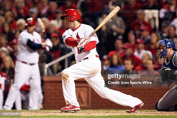 St. Louis Cardinals third baseman David Freese hits against the Los Angeles Dodgers during game six of the NLCS Playoffs at Busch Stadium in St....
