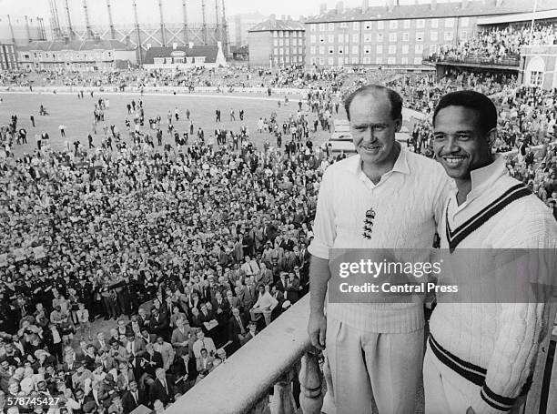 England cricket captain Brian Close and West Indies captain Garfield Sobers on the balcony of the pavillion at The Oval , London, after England won...