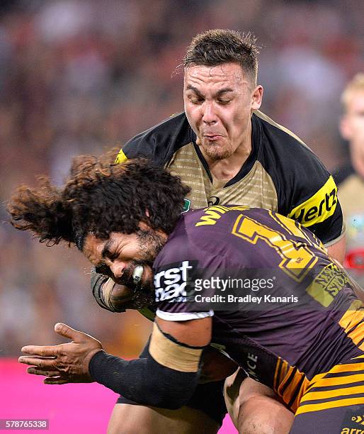 James Fisher-Harris of the Panthers takes on the defence of Adam Blair of the Broncos during the round 20 NRL match between the Brisbane Broncos and...