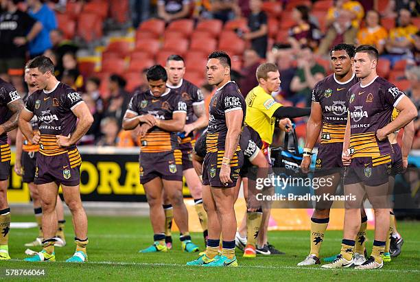 Broncos players are dejected after losing the round 20 NRL match between the Brisbane Broncos and the Penrith Panthers at Suncorp Stadium on July 22,...