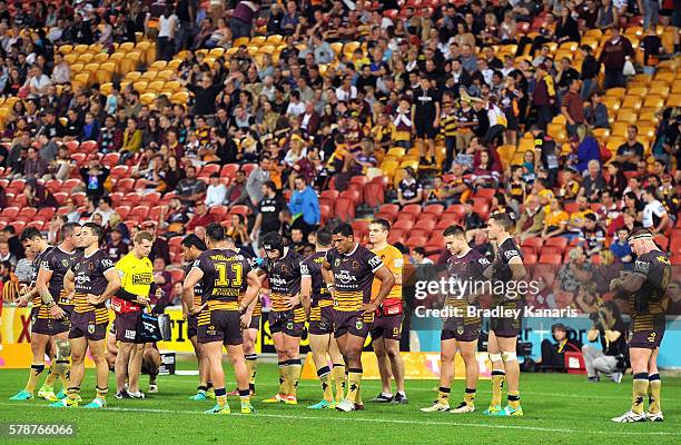 Broncos players are dejected after losing the round 20 NRL match between the Brisbane Broncos and the Penrith Panthers at Suncorp Stadium on July 22,...