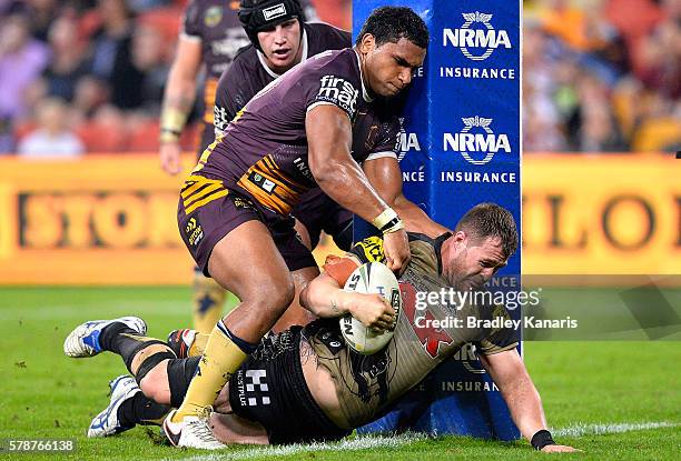 Trent Merrin of the Panthers barges over to score a try during the round 20 NRL match between the Brisbane Broncos and the Penrith Panthers at...