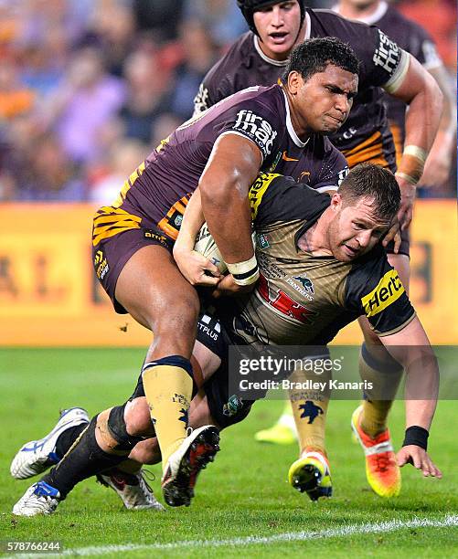 Trent Merrin of the Panthers barges over to score a try during the round 20 NRL match between the Brisbane Broncos and the Penrith Panthers at...