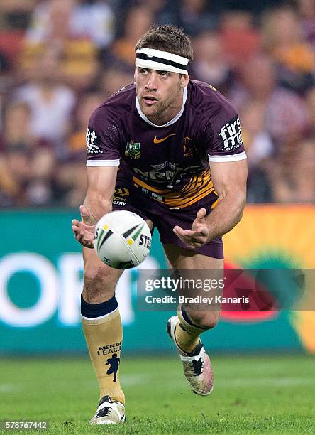 Andrew McCullough of the Broncos passes the ball during the round 20 NRL match between the Brisbane Broncos and the Penrith Panthers at Suncorp...