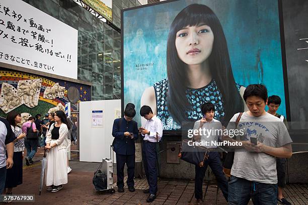 Pokemon players plays in front of Shibuya station as &quot;Pokemon Go&quot; finally launches it's first day in Japan on Friday, July 22, 2016.