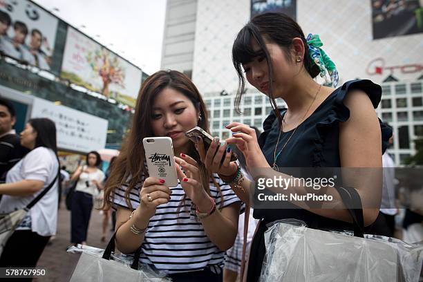 Pokemon players plays in front of Shibuya station as &quot;Pokemon Go&quot; finally launches it's first day in Japan on Friday, July 22, 2016.