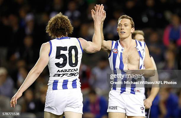 Ben Brown and Drew Petrie of the Kangaroos celebrate during the 2016 AFL Round 18 match between the Collingwood Magpies and the North Melbourne...