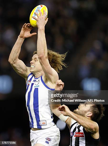 Ben Brown of the Kangaroos and Nathan Brown of the Magpies compete for the ball during the 2016 AFL Round 18 match between the Collingwood Magpies...