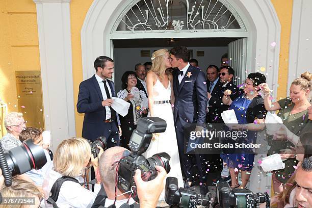 Bridegroom Mario Gomez kisses his wife Carina Wanzung during the wedding of Mario Gomez and Carina Wanzung at registry office Mandlstrasse on July...