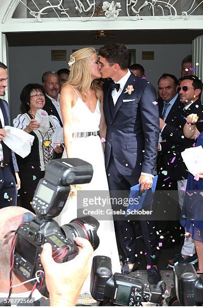 Bridegroom Mario Gomez kisses his wife Carina Wanzung during the wedding of Mario Gomez and Carina Wanzung at registry office Mandlstrasse on July...