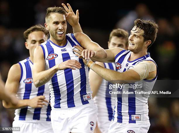 Jamie Macmillan of the Kangaroos celebrates a goal with Brad McKenzie of the Kangaroos during the 2016 AFL Round 18 match between the Collingwood...