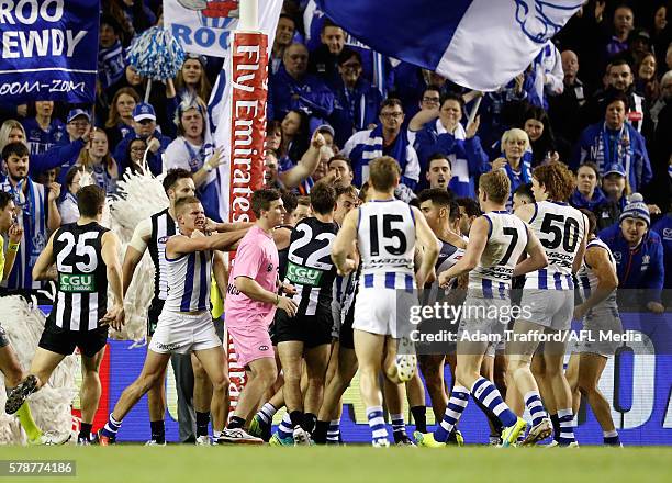 Players remonstrate during the 2016 AFL Round 18 match between the Collingwood Magpies and the North Melbourne Kangaroos at Etihad Stadium on July...