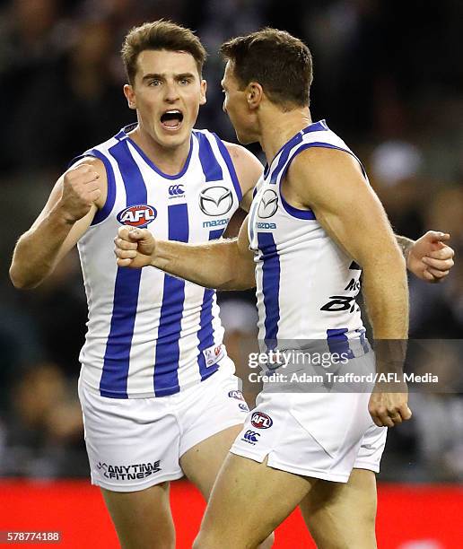 Brent Harvey of the Kangaroos celebrates a goal with Aaron Mullett of the Kangaroos during the 2016 AFL Round 18 match between the Collingwood...
