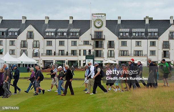 Crowds cross the 18th fairway during the second day of The Senior Open Championship at Carnoustie Golf Club on July 22, 2016 in Carnoustie, Scotland.