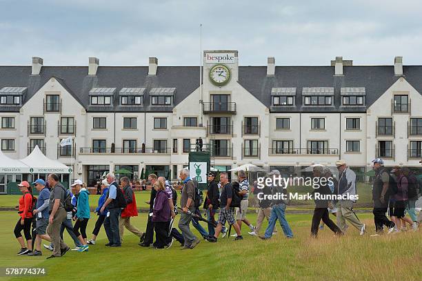 Crowds cross the 18th fairway during the second day of The Senior Open Championship at Carnoustie Golf Club on July 22, 2016 in Carnoustie, Scotland.
