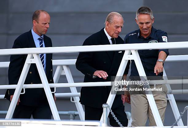 Prince Philip, Duke of Edinburgh is shown round by Martin Whitmarsh during day one of the Louis Vuitton America's Cup World Series on July 22, 2016...