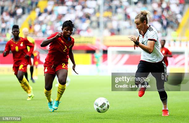 Hillia Kobblah of Ghana challenges Simone Laudehr of Germany during the women's international friendly match between Germnay and Ghana at Benteler...