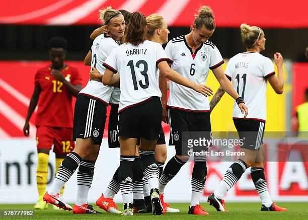 Alexandra Popp of Germany clebrates with team mates after scoring the third goal during the women's international friendly match between Germnay and...