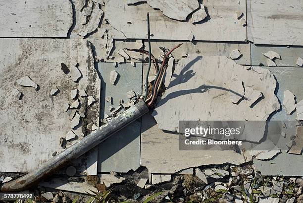 Old electrical wiring is exposed outside on a floor in Pomeroy, Ohio, U.S., on Monday, July 18, 2016. Donald Trumps message, repeated at the...