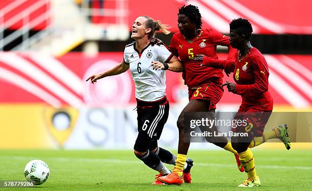 Simone Laudehr of Germany is challenged by Faiza Ibrahim of Ghana during the women's international friendly match between Germnay and Ghana at...