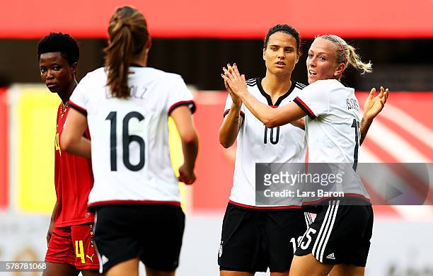 Mandy Islacker of Germany celebrates with team mates after scoring her teams tenth goal during the women's international friendly match between...