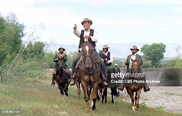 Theatrical movie originally released June 21, 1972. The film directed by Daniel Mann. Pictured in foreground, William Holden leads his men. Frame...