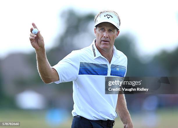 Stuart Appleby of Australia hits waves to fans after a par on the sixth hole during the second round of the RBC Canadian Open at Glen Abbey Golf Club...