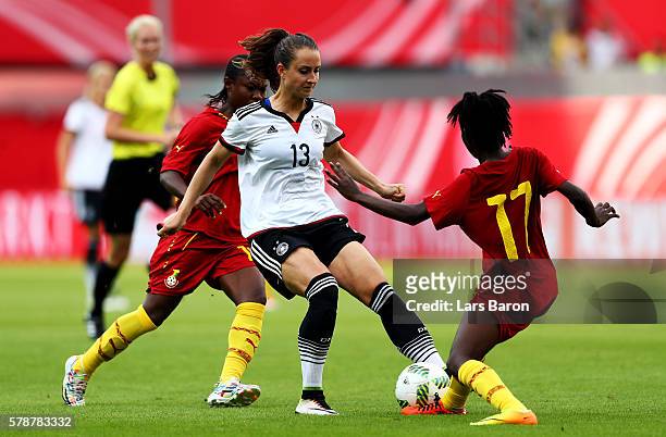 Sara Daebritz of Germany is challenged by Regina Antwi of Ghana during the women's international friendly match between Germnay and Ghana at Benteler...