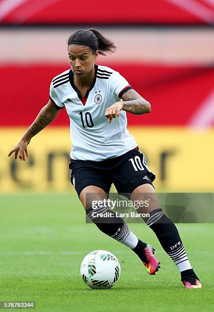 Dzsenifer Maroszan of Germany runs with the ball during the women's international friendly match between Germnay and Ghana at Benteler Arena on July...