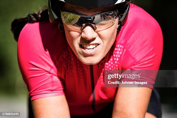 woman cycling, close-up - female on bike stock-fotos und bilder