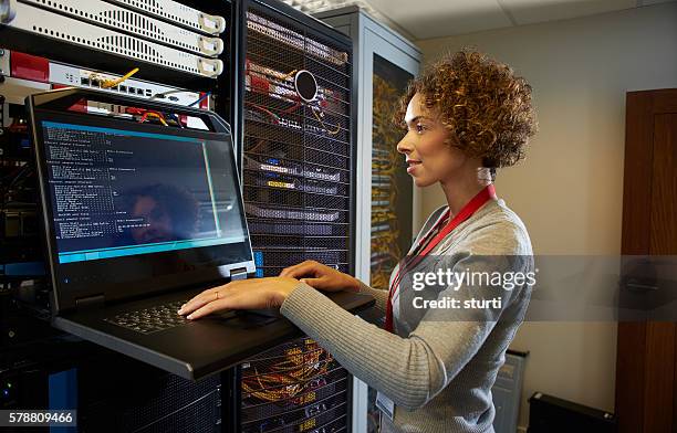 server room it programmer. - female computer programmer stock pictures, royalty-free photos & images