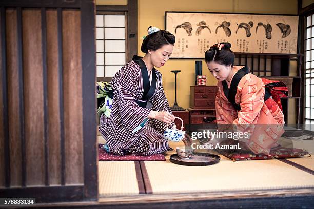 let me pour you tome tea - tea ceremony stock pictures, royalty-free photos & images