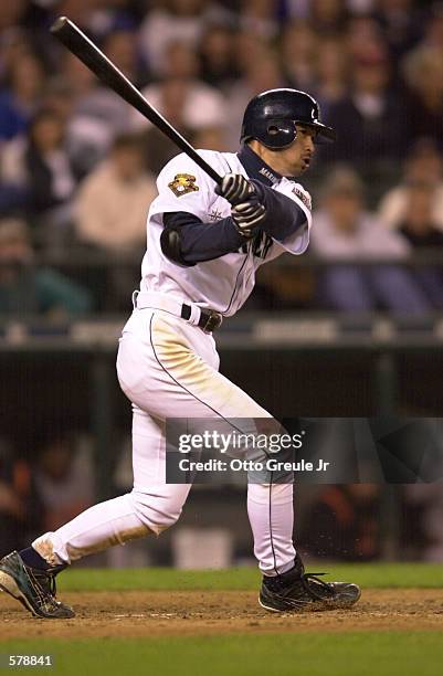 Ichiro Suzuki of the Seattle Mariners drives a ball into the right field corner for a double in the eighth inning against the Baltimore Orioles at...